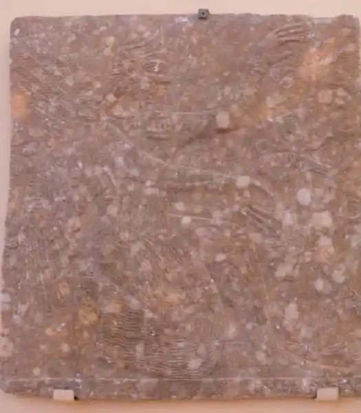 Genie - a winged man kneeling in front a tree of life Genie - a winged man kneeling in front a tree of life